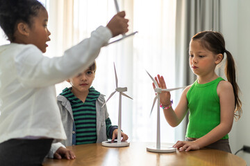 Portrait happy teacher help school children student having fun activity learn play renewable energy from solar windmill, education, science, environment, Eco, wind turbines, class at elementary school