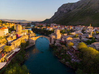 Fototapeta na wymiar erial Mostar Bridge and Koski Mehmed Pasha Mosque drone view of the historical city of Mostar, Ottoman architecture view of Bosnia is the most beautiful city in Europe