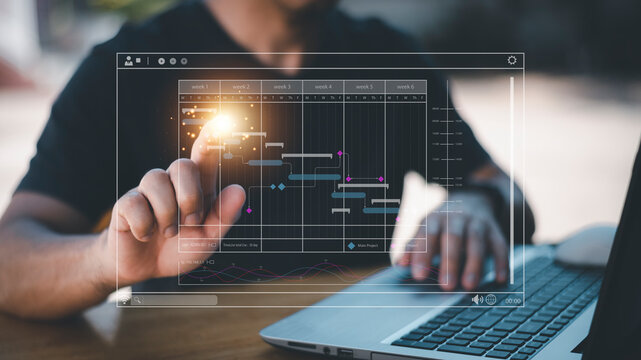 Analyst working with computer in Business Analytics and Data Management System to make report with KPI and metrics connected to database. Corporate strategy for finance, operations, sales, marketing