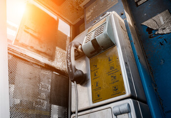 Old and dirty street phones at the city landfill