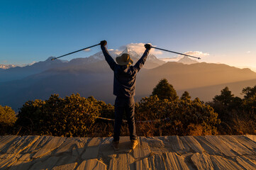 A young traveller trekking in Poon Hill view point in Ghorepani, Nepal..