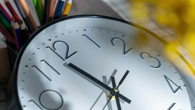 Closeup shot of details on a white black wall clock