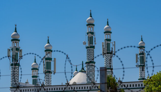 Blurred barbed wire in foreground at Habibia Soofie Masjid Mosque in Athlone near Cape Town South Africa