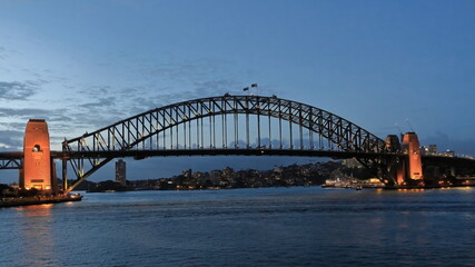 Fototapeta premium Sydney Harbour Bridge-arch and pylons-viewed from the Opera House at twilight under floodlight. NSW-Australia-585