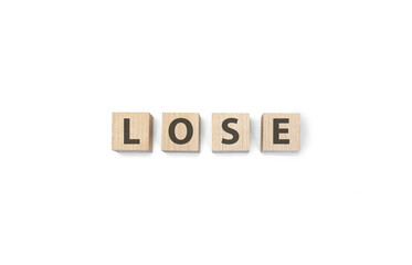 lose word on wooden cubes on white background