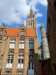 Fototapeta premium Bruges, April 2023: Magnificent facades of the buildings of Bruges, the Venice of the North