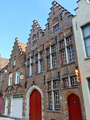 Fototapeta premium Bruges, April 2023: Magnificent facades of the buildings of Bruges, the Venice of the North