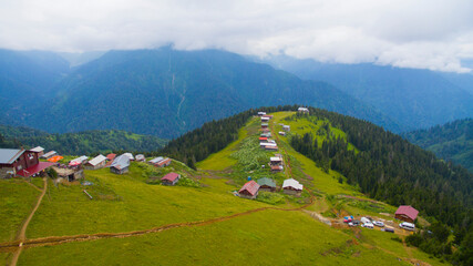 Fototapeta na wymiar POKUT PLATEAU aerial view with foggy weather. This plateau located in Camlihemsin district of Rize province. Kackar Mountains region. Rize, Turkey. Drone shot.
