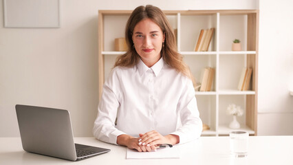 Office worker. Elegant woman. Stylish look. Smiling lady in white shirt sitting desk with documents...