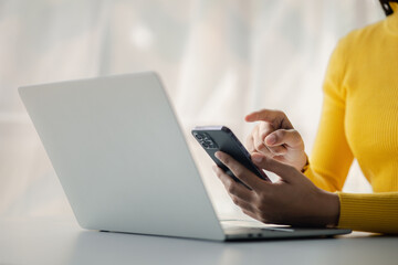 A person holds a mobile phone to use social media on a smartphone, communicating via the Internet on a smartphone. The concept of using technology in communication.