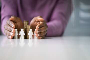 Hands Protecting The Coin Stack And White Figures