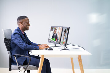 Businessman Video Conferencing On Computer
