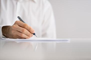 Lawyer Signing Business Contract Document