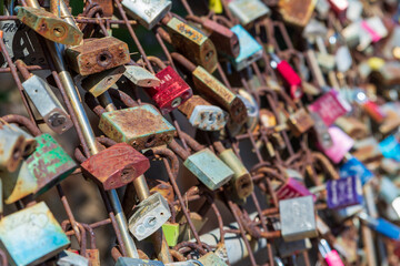 metal padlocks on a bridge as a sign of eternal love