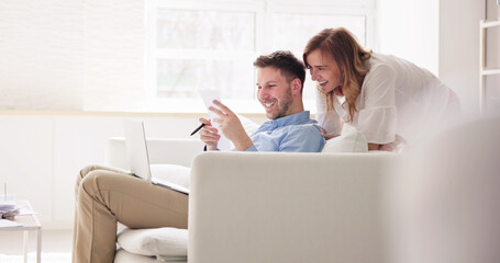 Obraz premium Portrait Of Couple Doing Home Finance