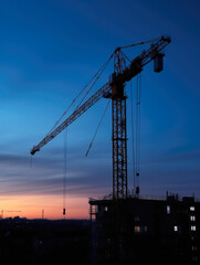 Construction crane at twilight, vertical photo. High quality generative ai