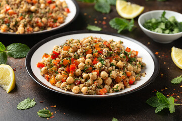 Chickpea Salad with Quinoa, sweet red pepper, herbs and lemon. Healthy food
