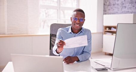 Holding Paycheck Or Payroll Check Or Insurance Cheque