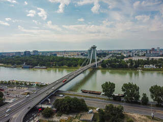 Fototapeta na wymiar Aerial vIew by drone. Summer. Bratislava, Presburg. Slovakia. Bridge on Danube river.