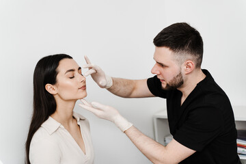 Consultation with ENT before rhinoplasty plastic surgery to change nose shape and improve breathing. Rhinoplasty is reshaping nose surgery for change appearance of the nose and improve breathing. - obrazy, fototapety, plakaty