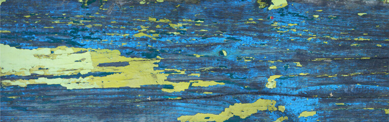 Aged wooden board painted blue and yellow