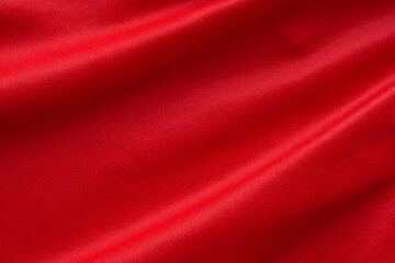 Fototapeta na wymiar Red sports clothing fabric football shirt jersey texture background