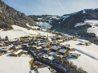 Aerial view Alpbach town in Kufstein, Tirol. Austria by drone. Alps mountains. Winter. Snow.