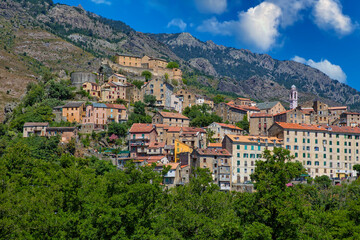 Obraz premium View of the old town of Corte in the heart of Corsica. Corte is located in inland of Corsica surrounded by green forests and the cliffs of Restonica mountains, Corsica island, France