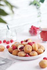 A plate wit traditional berliner cakes with jelly