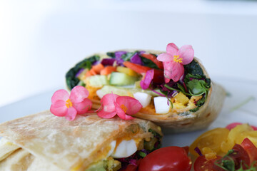 Wrap close up, cut in half filled with mixed greens