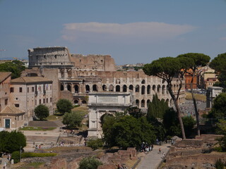 Obraz premium View of Via Sacra, Arch of Titus, and the Colosseum. Rome, Italy 