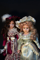 Studio Portrait Photography of Two Porcelain Dolls.