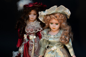 Studio Portrait Photography of Two Porcelain Dolls.