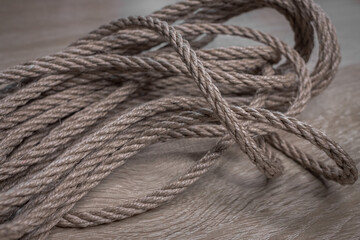 Texture of jute rope close-up. Twisted coarse rope. A skein of jute. Natural material for decoration. Textile cord. Small rope.