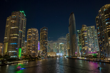 Fototapeta na wymiar Night urban landscape of downtown district of Miami Brickell in Florida, USA. Skyline with brightly illuminated high skyscraper buildings in modern american megapolis