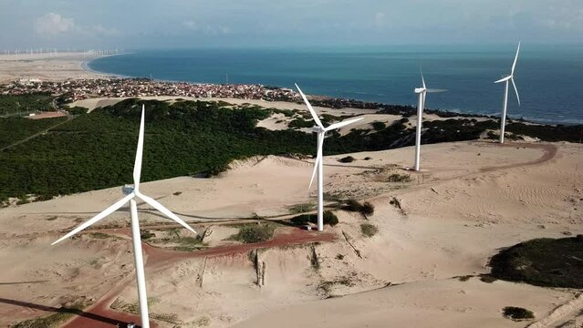wind turbines in the dunes of canoa quebrada, cear&aacute; state, brazil