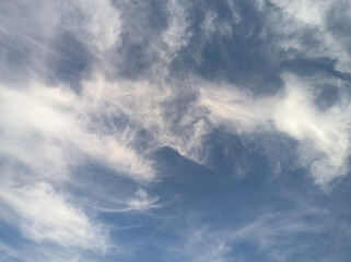 Naklejka na ściany i meble Blurred clouds that seem to be glued together. blue sky in the morning