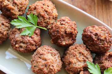 Frikkadels or meatballs on a tray. Frikkadels are a South African meatball