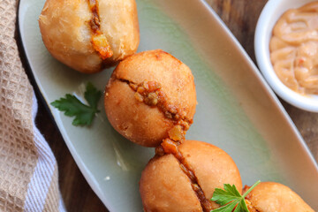 Mini beef vetkoek. South African deep fried dough usually filled with curried minced meat or jam