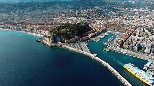 Nice, France beautiful aerial cityscape and panoramic view of harbor with luxury yachts, cruise ship in the French Riviera the southeastern coast of France on the Mediterranean Sea from above 4K UHD
