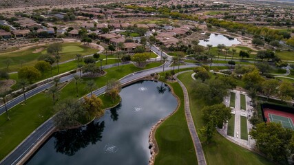 Aerial view of a golf club and tennis courts in a new neighborhood in VIstancia, Arizona