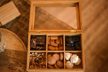 Fotobehang Selective shot of Turkish homemade coffee cookies in a wooden box © Sanja Peric/Wirestock Creators