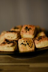 Vertical shot of homemade black sesame scones placed on a plate