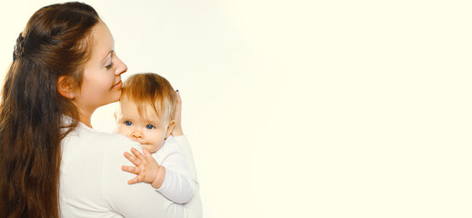 Portrait of happy mother holding her cute baby on white background
