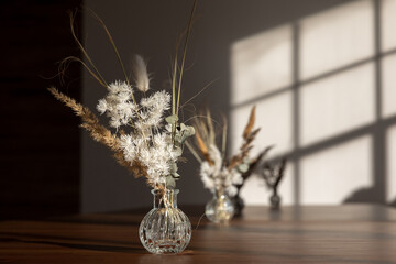 Bouquet of dried flowers against background of window