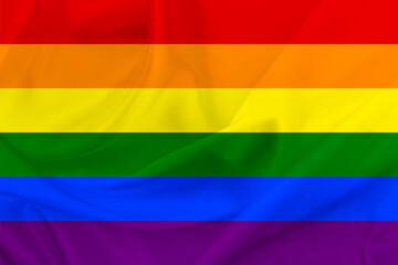 A rainbow flag background. LGBT