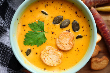 Butternut or pumpkin soup with croutons and pumpkin seeds 