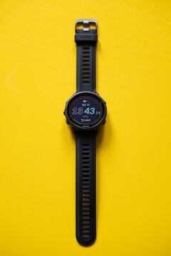 Garmin Forerunner 955 Solar running smartwatch against a yellow background