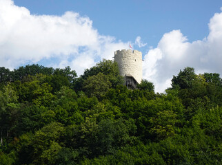 Ruins of a historic castle among trees on a sunny summer day, Kazimierz Dolny, Poland