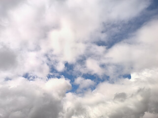 White clouds try to cover the whole sky